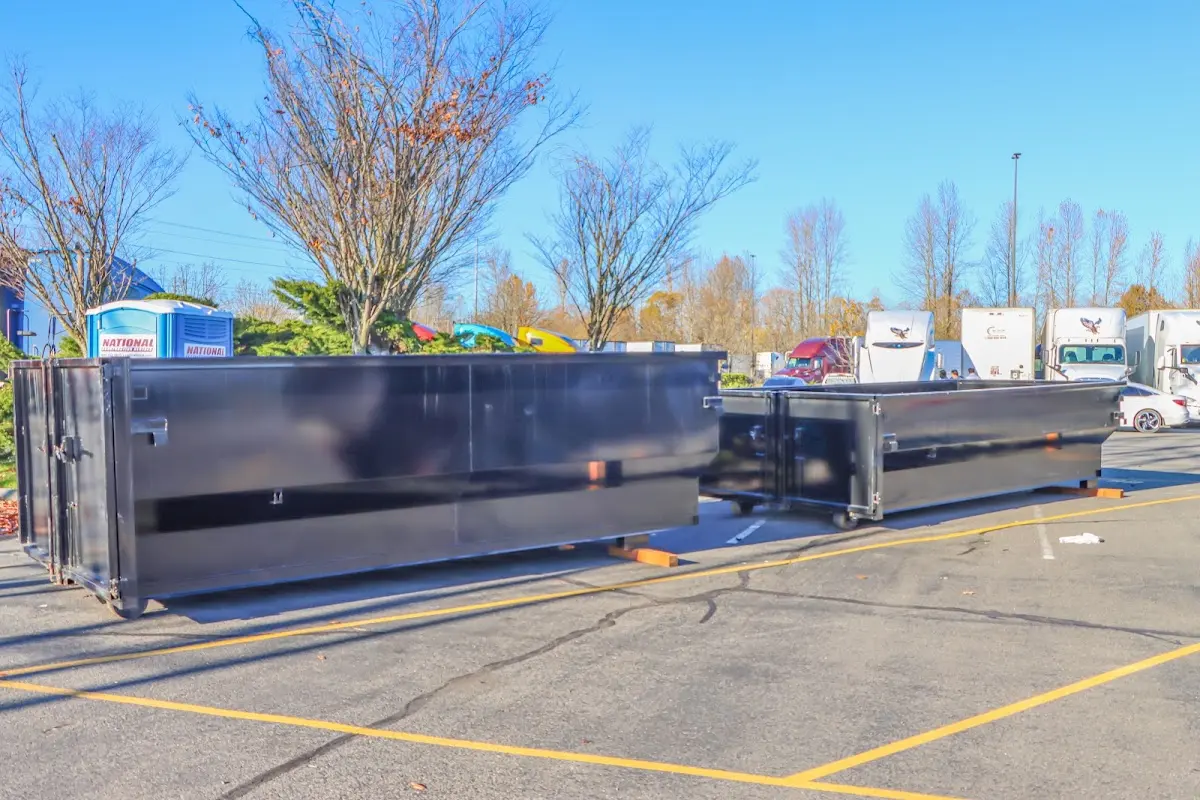 Professional dumpster rental service with roll-off container on residential driveway in Plant City